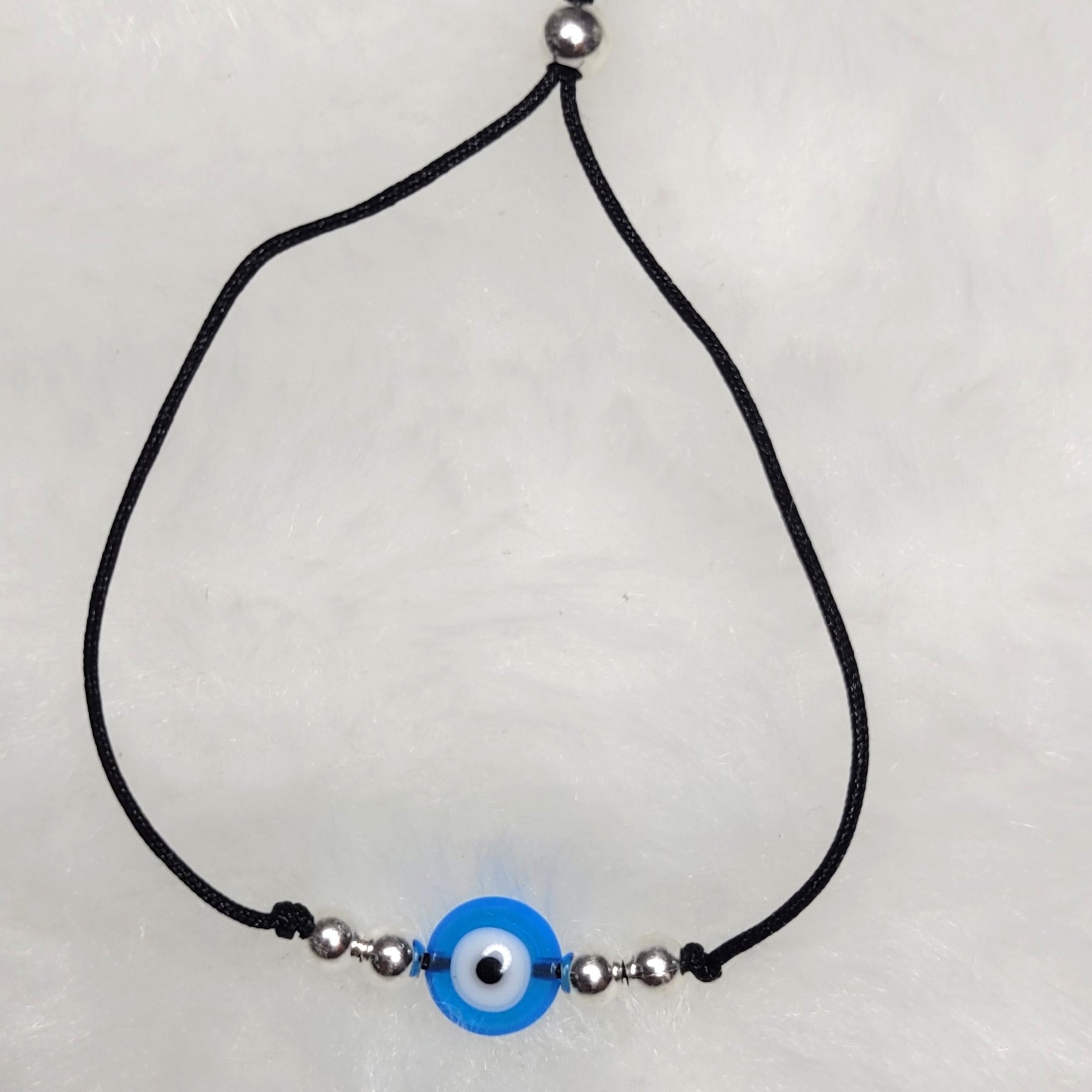 Pulseira regulável  bolas prata olho grego
