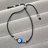 Pulseira regulável  bolas prata olho grego