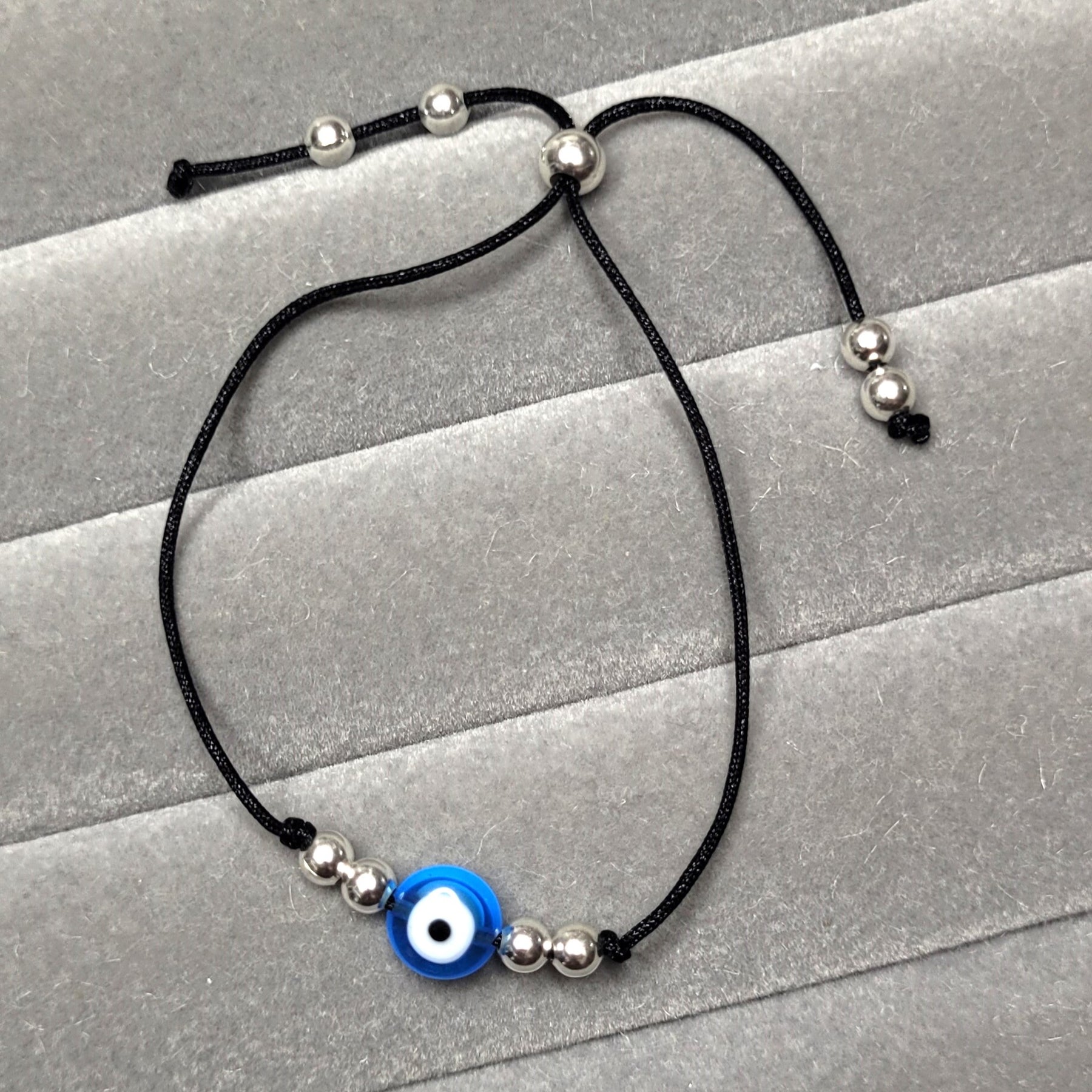 Pulseira regulável  bolas prata olho grego